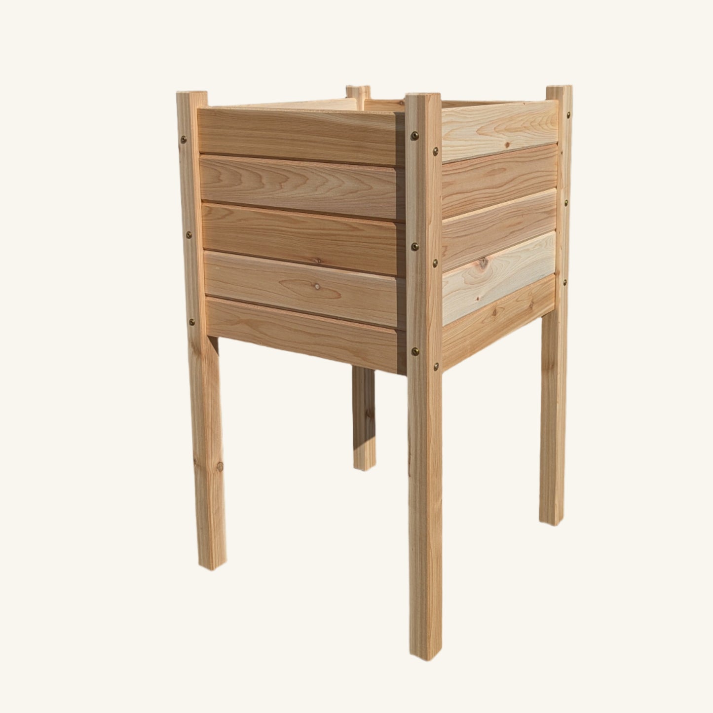 Angled view of 18x18x32 raised cedar garden box by Kelowna Woodcraft showing sturdy leg construction and weather-resistant fasteners.