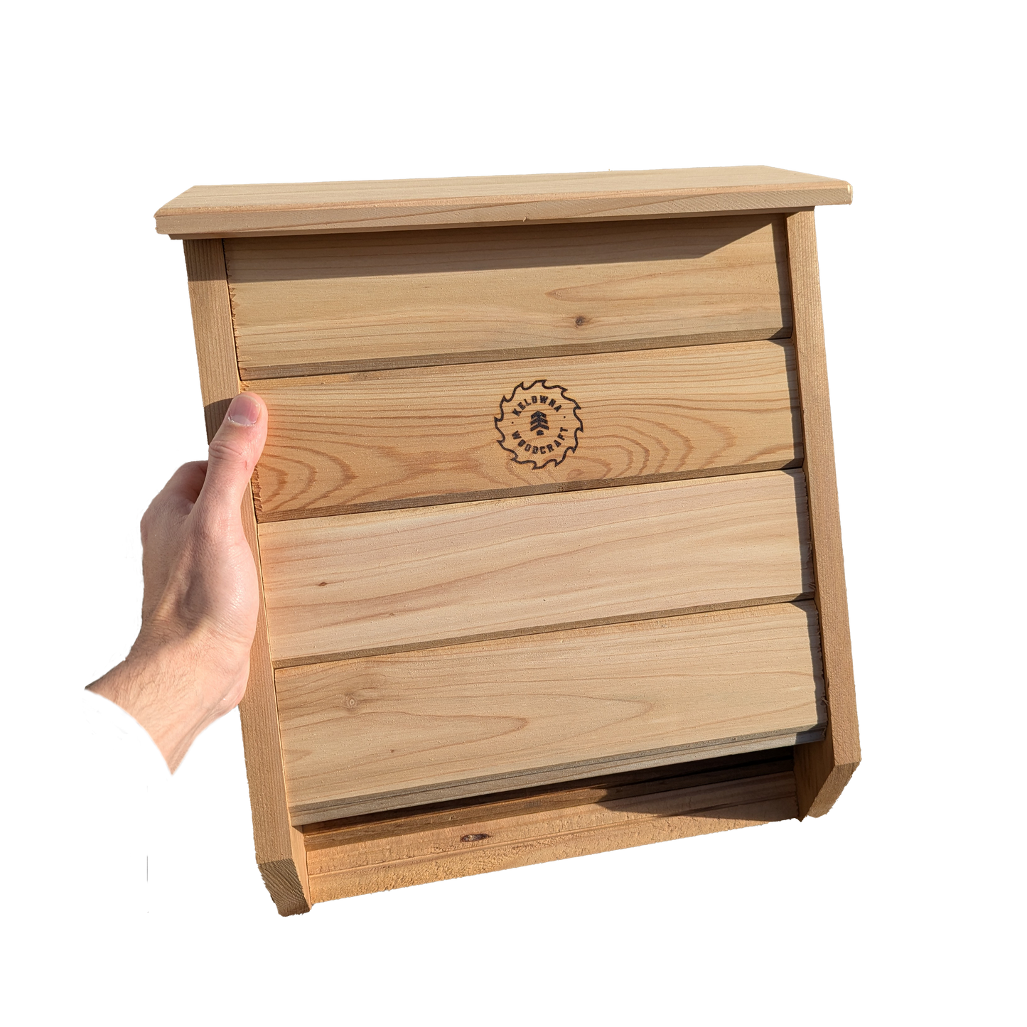 Cedar bat box mounted on a tree in a natural outdoor setting, providing safe shelter for bats while enhancing backyard ecosystems, handcrafted in BC by Kelowna Woodcraft.