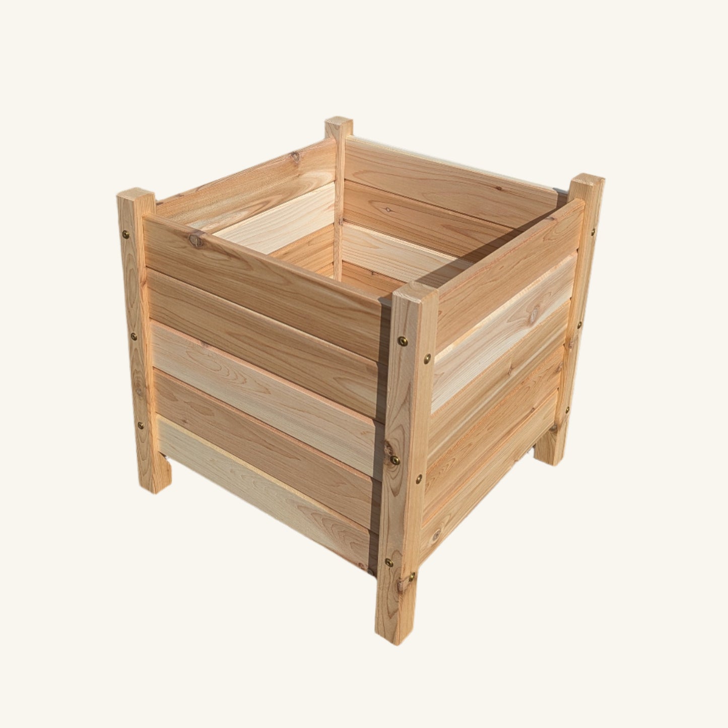 Top-down image of Kelowna Woodcraft 18x18 cedar garden box showing deep planting area and corner assembly with visible GRK RSS structural fasteners.