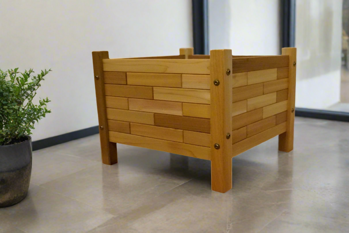 Close-up of 17x17 cedar planter box showing unique brick pattern and fine Western Red Cedar grain, handmade by Kelowna Woodcraft in British Columbia.