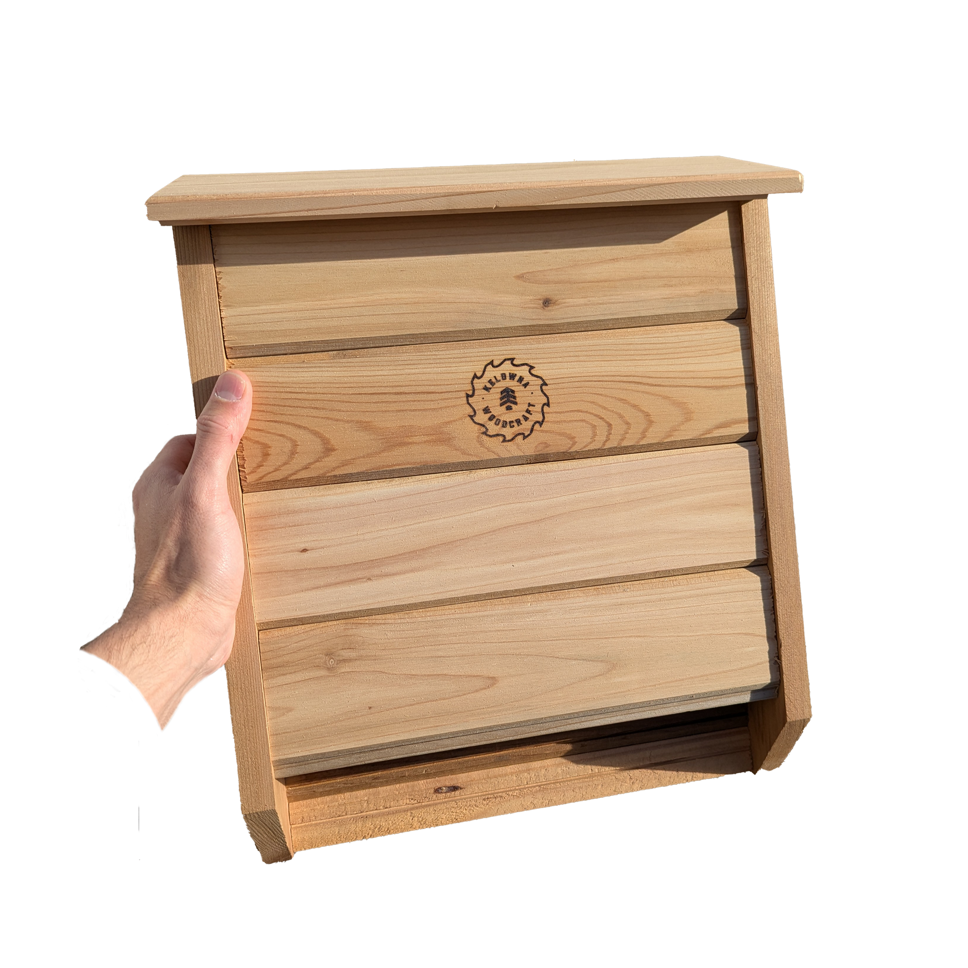 Cedar bat box mounted on a tree in a natural outdoor setting, providing safe shelter for bats while enhancing backyard ecosystems, handcrafted in BC by Kelowna Woodcraft.