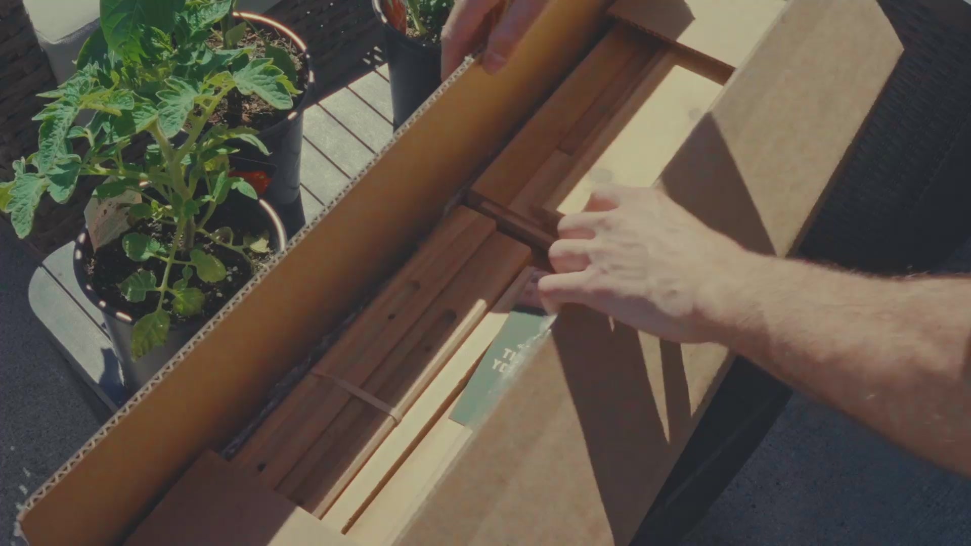 Load video: Artistic video showing a handcrafted cedar planter box being unboxed, assembled, and filled with soil and plants. Highlights the natural beauty, premium materials, and quality craftsmanship of Kelowna Woodcraft’s locally made planter boxes.